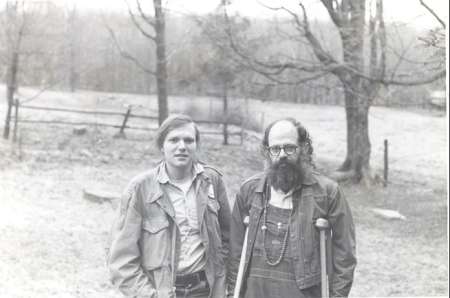 Allen Ginsberg (right) with Gordon Ball, photographed by Peter Orlovsky from front of farmhouse, facing meadow and woods-enclosed tarpaper shack of neighbor Ed "The Hermit." March 1973.