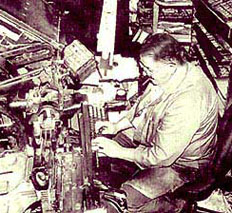 Hiram Bamberger at the keyboard of his Linopentametron machine