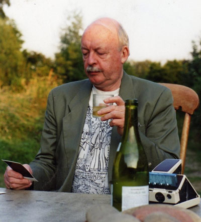 JW in Norfolk, England, Summer 1993, warming a polaroid from his trusted SX70 Land Camera, whilst ice-cubes melt in his glass.