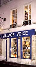 Photo of the Village Voice bookstore at night